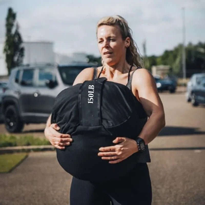 sacs de sable d'entrainement physique porté par unefemme